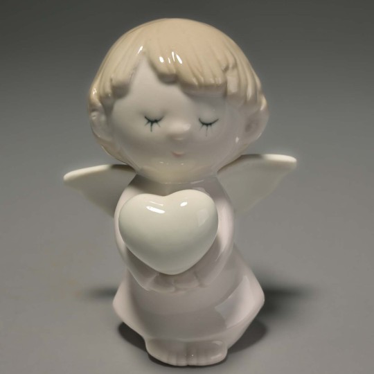 Descrizione Prodotto: Angelo Pregante 8x6x10,5 cm. in porcellana lucida bianco e rosa